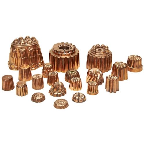 145 - A COLLECTION OF VICTORIAN COPPER JELLY MOULDS various shapes and sizes. (19)14 cms high maxPROVENANC... 