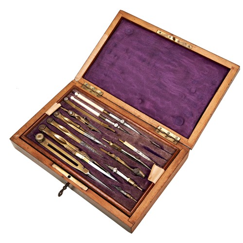 131 - A VICTORIAN ENGINEERS DRAWING INSTRUMENT SET containing a selection of brass, steel and bone handled... 