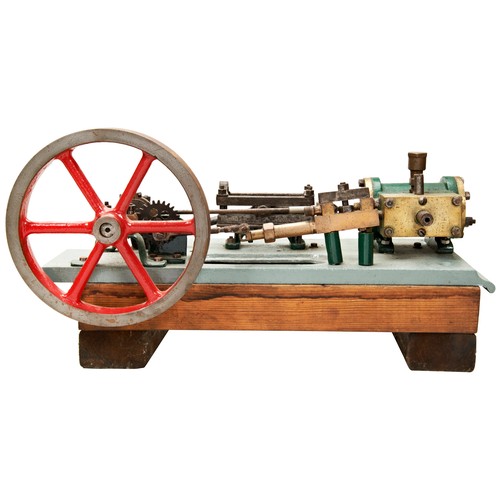 169 - A HEAVY ENGINEERED MODEL OF A HORIZONTAL STEAM ENGINE on a cast iron platform and wooden base, some ... 