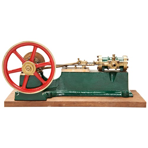 170 - AN ENGINEERED MODEL OF A HORIZONTAL STEAM ENGINE on a cast iron base with brass flywheel and fitting... 