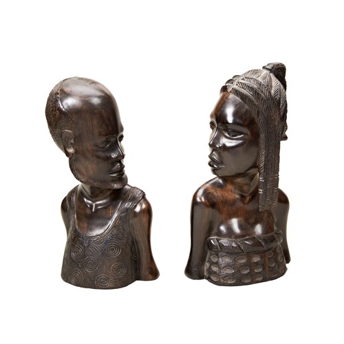 61 - A PAIR OF AFRICAN CARVED IRONWOOD BUSTS OF A MAN AND WOMAN 20th century31 cms maxPROVENANCE: The Dav... 