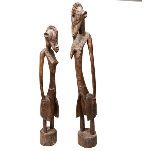 68 - A WEST AFRICAN STANDING FIGURE AND ANOTHER SIMILAR 20th century.                                   8... 