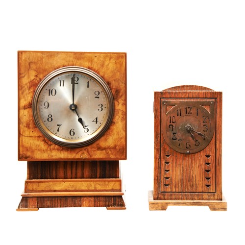 392 - A WALNUT CLOCK, C1930 ON A STEPPED BASE and a small Continental Arts & Crafts oak mantel clock w... 