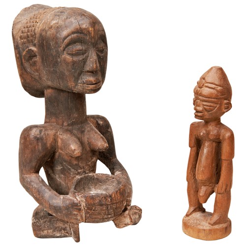 67 - A VINTAGE SEATED LUBA FEMALE FIGURE WITH A BOWL a stylised Dogon figure and another figure.28 cms ma... 