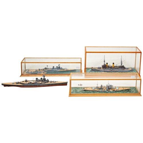 196 - A CASED MODEL KIT OF A WWI CRUISER a cased WWI battleship model, another and an uncased model. Some ... 