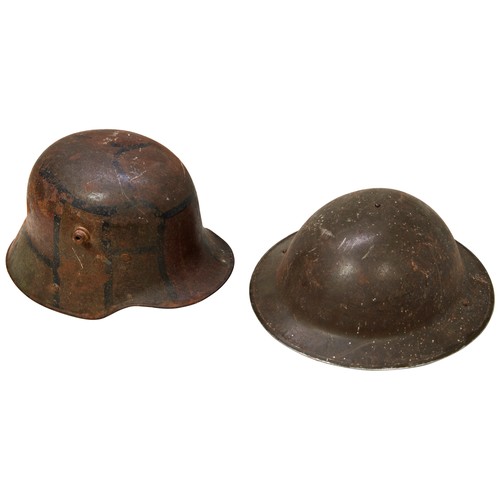 400 - A GERMAN WORLD WAR I M16 STEEL HELMET with original Sz 62 camouflage paint and partial remains of li... 