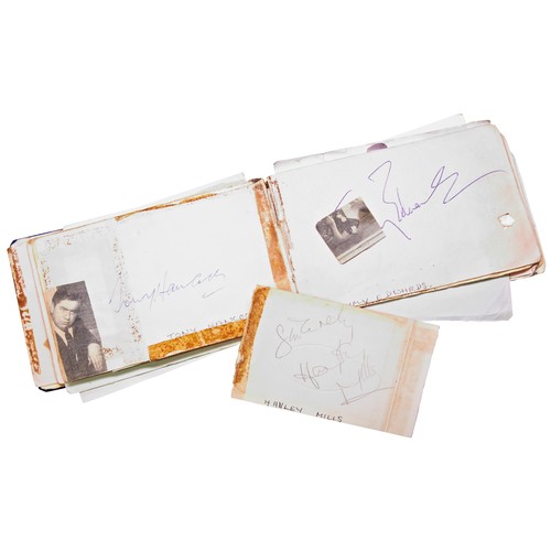 496 - AN AUTOGRAPH BOOK CONTAINING NUMEROUS SIGNATURES INCLUDING BILL WYMAN (X2), MICK JAGGER, PAUL JONES,... 