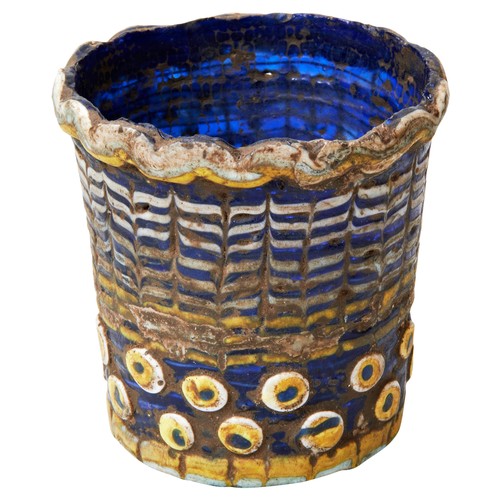 471 - AN ANCIENT EGYPTIAN CORE-FORMED GLASS VESSEL of beaker shaped form, the cobalt blue body with raised... 