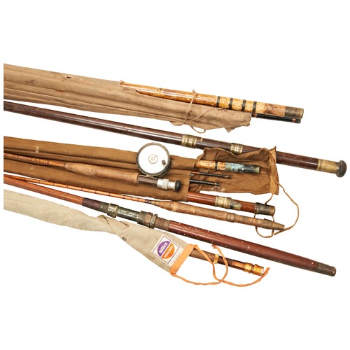 473 - A LONG WOODEN TRANSIT CASE CONTAINING A SELECTION OF SPLIT CANE AND BAMBOO FISHING RODS, dating from... 