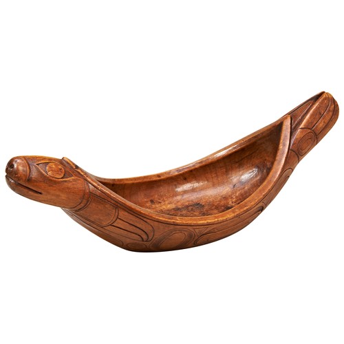 601 - A GOOD CEDARWOOD HAIDA GREASE BOWL in the Form of a Seal carved in stylised elongated flowing form w... 