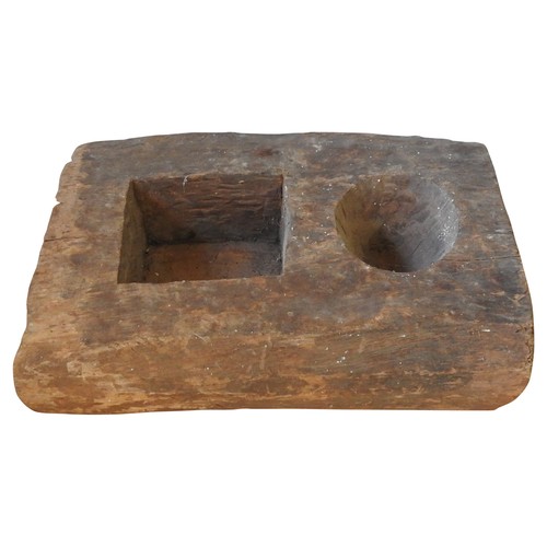 604 - INDONESIAN WOODEN MORTAR with two square and circular compartments70 H x 30 W x 46 D cms