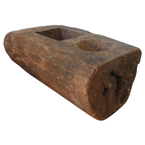 604 - INDONESIAN WOODEN MORTAR with two square and circular compartments70 H x 30 W x 46 D cms