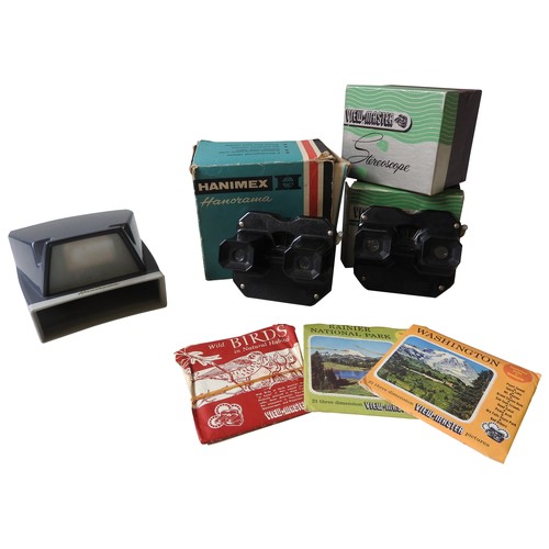 448 - A VIEW-MASTER BLACK BAKELITE STEREOSCOPE, another, a selection of View-Master discs including the Co... 