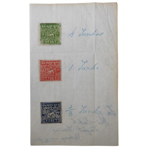 590 - A GROUP OF THREE TIBETAN POSTAGE STAMPS to include a 2/3 Shanka, a 1 Shanka and a 4 Shanka mounted o... 