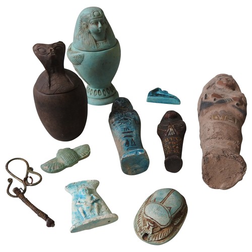 609 - A FAIENCE SHABTI FIGURE, a faience winged scarab and other Egyptian style ornaments and souvenirs. 2... 