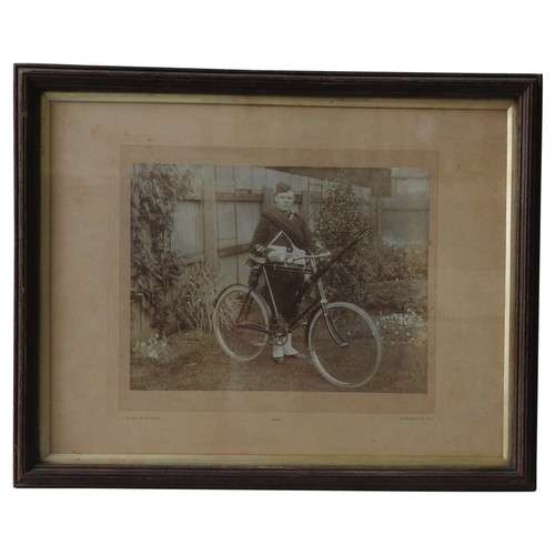 421 - A SEPIA PHOTOGRAPH OF A PROUD UNIFORMED 'CADET' WITH A LEE ENFIELD MOUNTED BICYCLE taken in a suburb... 