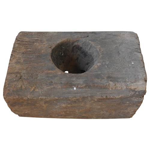 607 - INDONESIAN WOODEN BLOCK MORTAR with singular circular aperture57 H x 30 W x 35 D cms