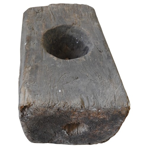 607 - INDONESIAN WOODEN BLOCK MORTAR with singular circular aperture57 H x 30 W x 35 D cms