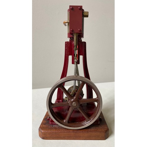 171 - AN ENGINEERED VERTICAL STEAM ENGINE with maroon livery and a small vertical steam piston with solid ... 