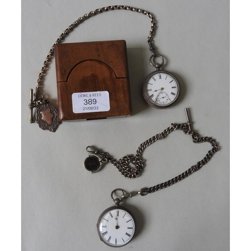 389 - A SILVER POCKET WATCH WITH SILVER WATCH CHAIN AND SWIVEL and another silver pocket watch with a watc... 