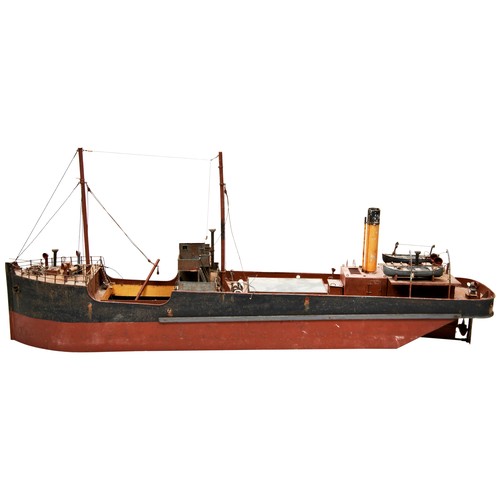 194 - A TINPLATE ELECTRICALLY POWERED MODEL COASTAL FREIGHTER the stern with printed name ‘Digger Melbourn... 