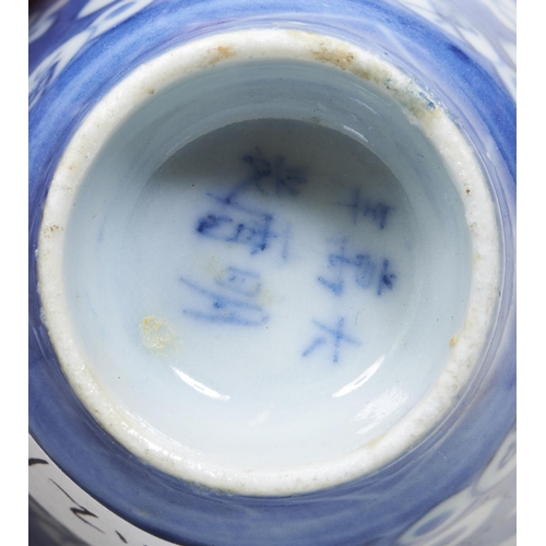 147 - TWO CHINESE BLUE AND WHITE WINE CUPSXUANDE MARKS BUT KANGXI PERIOD the sides decorated in tones of u... 