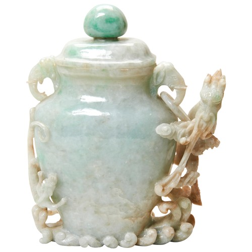 338 - CARVED JADEITE VASE AND COVER20TH CENTURYthe flattened baluster sides carved in high relief with a s... 