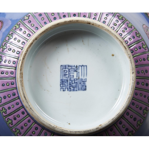 252 - FAMILLE ROSE PORCELAIN ENAMEL BOWLQIANLONG SEAL MARK AND OF THE PERIODthe powder-blue ground decorat... 