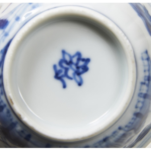 88 - THREE BLUE AND WHITE 'LOTUS-PETAL'-MOULDED WINE CUPSQING DYNASTY, 18TH CENTURYeach painted with cont... 