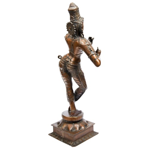 483 - BRONZE FIGURE OF DANCING KRISHNASOUTH INDIA, 19TH CENTURYstanding on a lotus base77cm high... 