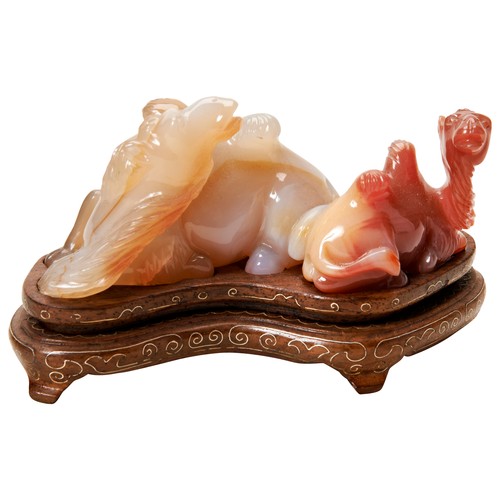 341 - CARVED CARNELIAN AGATE CAMEL GROUPREPUBLIC PERIODmodelled as two recumbent camels, on a fitted wire ... 