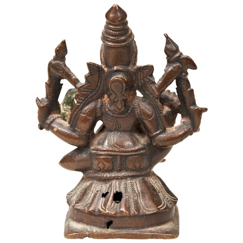 496 - A SMALL INDIAN BRONZE FIGURE OF GANESHA SEATED IN SVASTIKASANA 18TH CENTURYwith four arms holding va... 