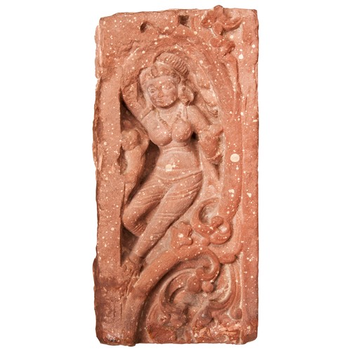 508 - A MOTTLED SANDSTONE RELIEF PANEL OF A DANCING DEITY, INDIA, PROBABLY UTTAR PRADESH, 10TH /11TH CENTU... 