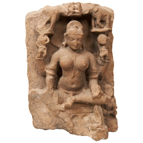 510 - A CARVED STONE MULTI-ARMED FEMALE DEITY, INDIAN, Possibly Lakshmi worn with age and with indistinct ... 