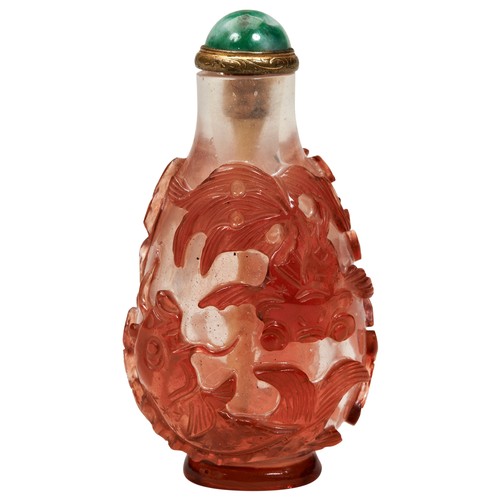 314 - RED-GLASS OVERLAY 'CARP' SNUFF BOTTLEQING DYNASTY, 19TH CENTURYthe pear-shaped bottle carved with fo... 