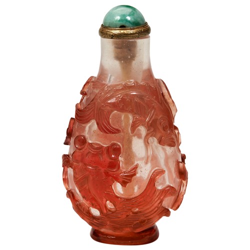 314 - RED-GLASS OVERLAY 'CARP' SNUFF BOTTLEQING DYNASTY, 19TH CENTURYthe pear-shaped bottle carved with fo... 