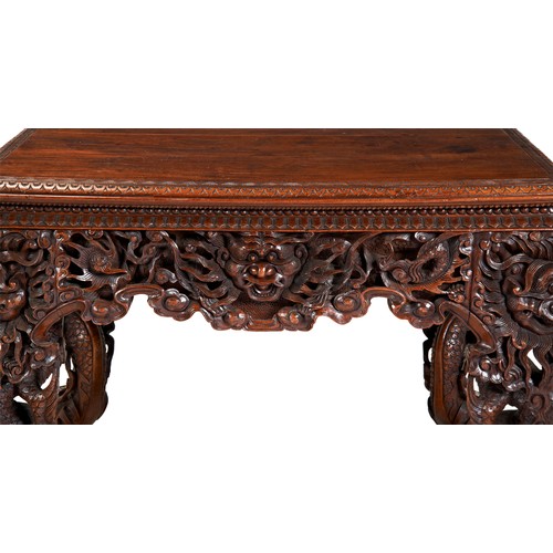 398 - GOOD CARVED HUANGHUALI CENTRE TABLEQING DYNASTY, 19TH CENTURYthe rectangular top with a carved edge,... 