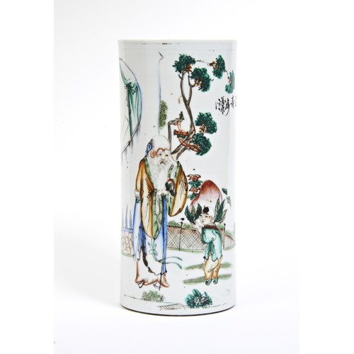 283 - FAMILLE ROSE CYLINDER VASELATE QING DYNASTYthe sides painted with Shoulao and attendant in a fenced ... 