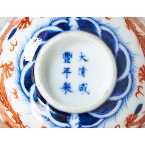 242 - UNDERGLAZE BLUE AND IRON-RED 'DRAGON' WINE CUPXIANFENG SIX CHARACTER MARK AND OF THE PERIODpainted w... 