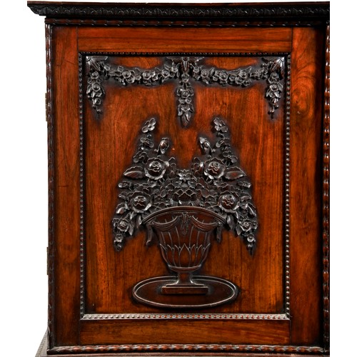 402 - ANGLO-CHINESE CARVED HUANGHUALI LIBRARY CABINETQING DYNASTY, CIRCA 1800the rectangular top with an i... 