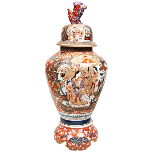 435 - LARGE JAPANESE IMARI COVERED JAR AND STAND20TH CENTURYdecorated in the typical palette with panels d... 