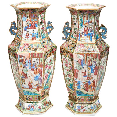 280 - GOOD PAIR OF CANTON FAMILLE ROSE VASESQING DYNASTY, 19TH CENTURYthe hexagonal sides intricately pain... 