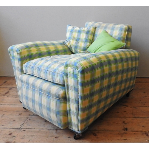 10 - A PAIR OF VINTAGE DEEP SEATED ARMCHAIRS, with back sloping arms, covered in a light blue and lemon y... 