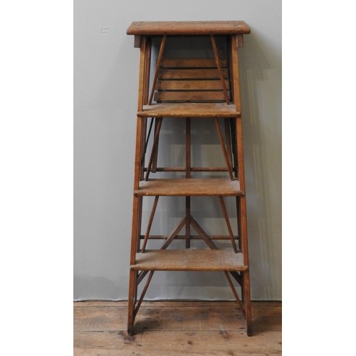 96 - A VINTAGE PINE FOLDING STEP LADDER, the four tread ladder with a fold down table top, 114 x 45 cm