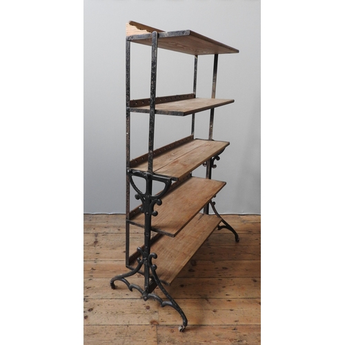 13 - AN INDUSTRIAL STYLE FIVE TIER BOOKSHELF, comprised of a heavy duty cast-iron stand, and five graduat... 