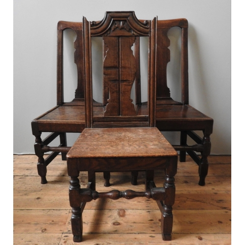 14 - A PAIR OF 18TH CENTURY OAK CHAIRS, with fiddle backs, on turned square form legs united by stretcher... 