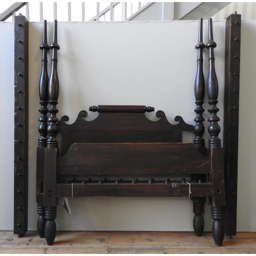 21 - AN AMERICAN 19TH CENTURY FOUR POSTER BED STEAD, with turned baluster supports flanking panelled scro... 