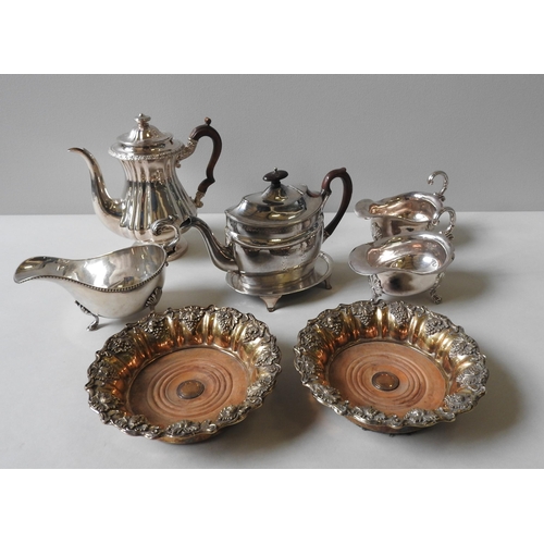 327 - A SILVER PLATED COFFEE POT, PLATED TEAPOT ON STAND, THREE LARGE PLATED SAUCE BOATS AND A PAIR OF PLA... 