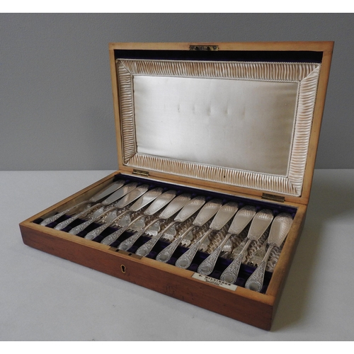 331 - A WILKINSON SILVER PLATED FISH SERVICE, twelve place setting, ornately engraved, in a silk lined oak... 