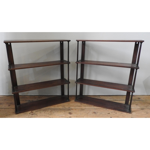 27 - A PAIR OF 19TH CENTURY MAHOGANY FOUR TIER WALL SHELVES, the four shelves united by turned Roman-styl... 